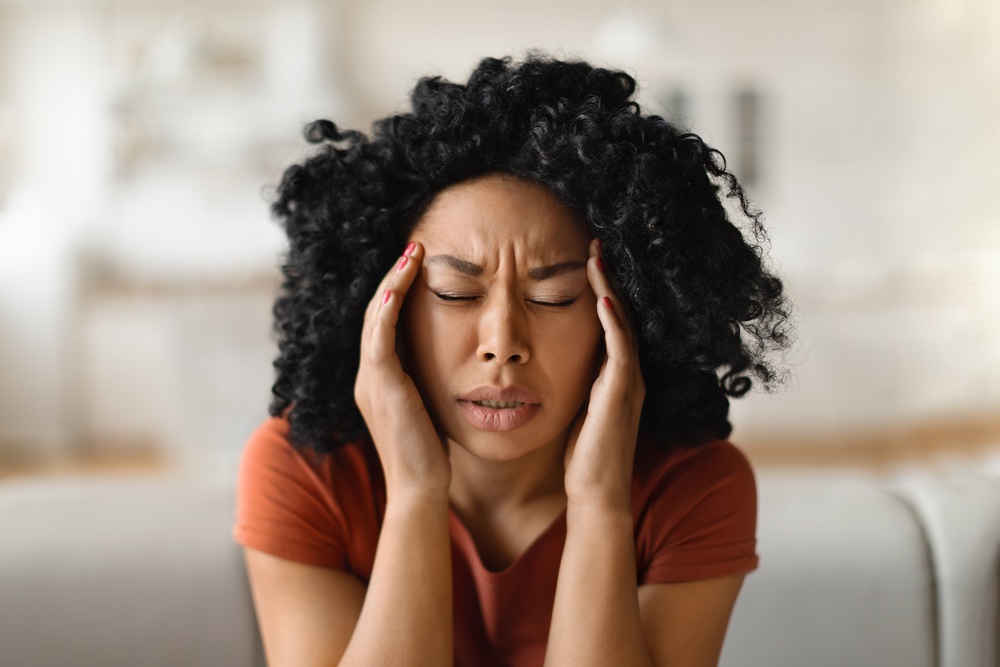 Woman hurting from a migraine