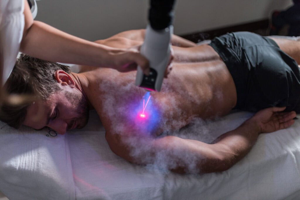 Localized cryotherapy sessions on a man's shoulder